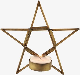 Foto av antik mässingsstjärna med värmeljushållare
