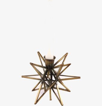 Foto av antik stjärnformad ljushållare i glas och metall