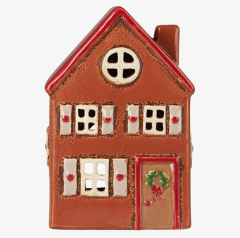 Bild av charmig ljuslykta i form av ett litet hus