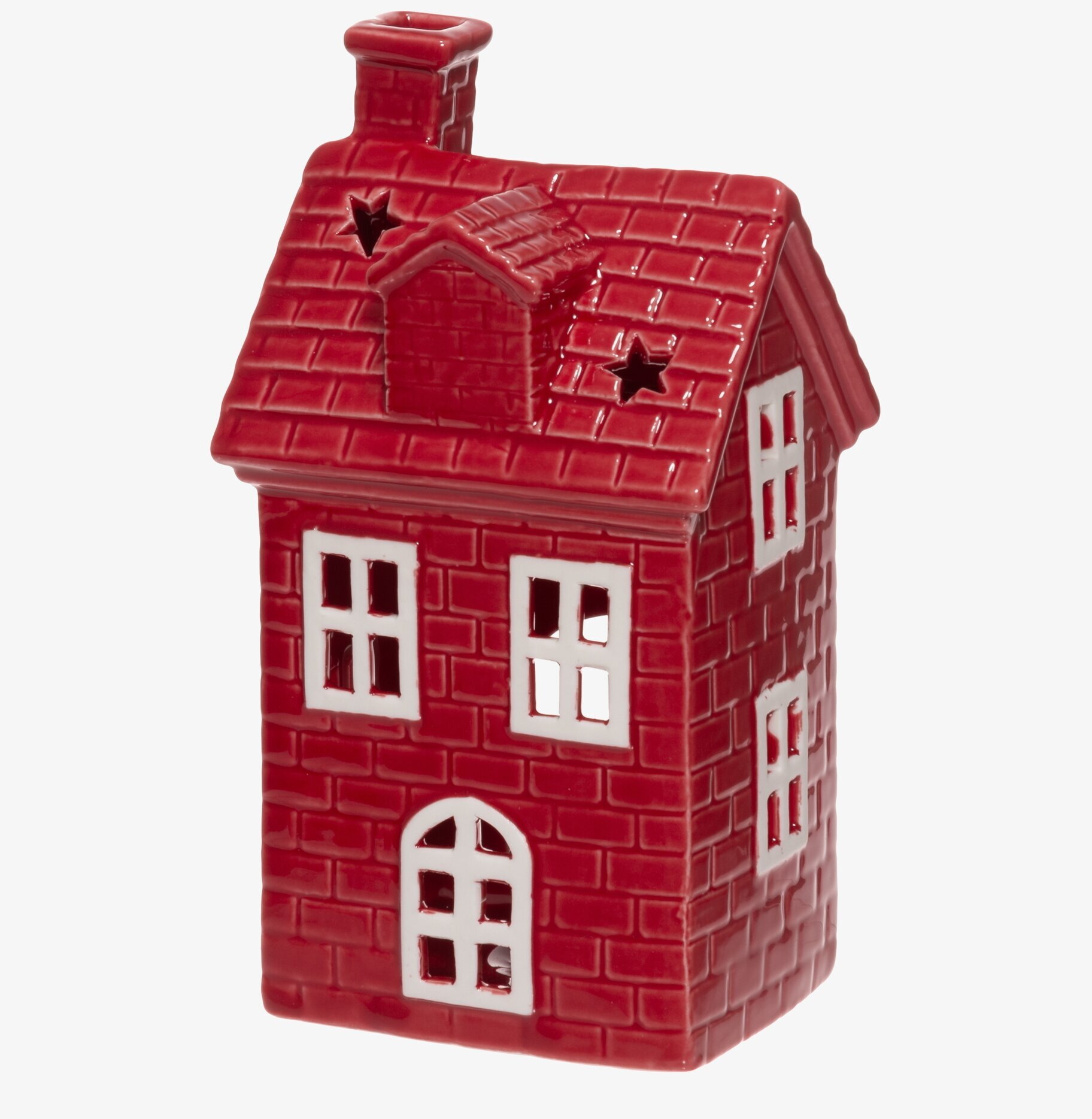 Bild av röd husformad ljuslykta med stjärnutskärningar