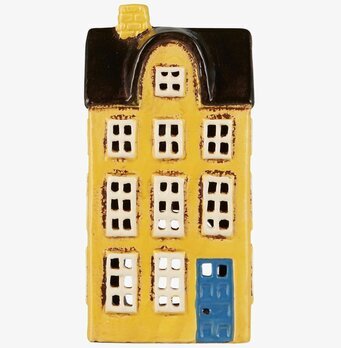 Foto av dekorativ gul ljuslykta i keramik med detaljer