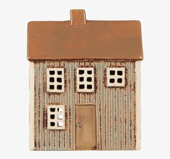 Bild av en detaljerad keramikljuslykta som ett litet hus