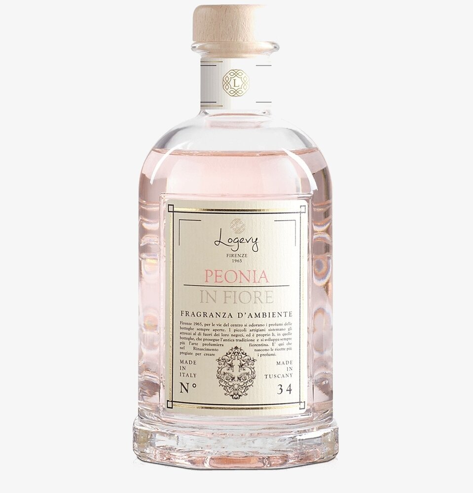 Bild av elegant flaska med doftpinnar i klart glas