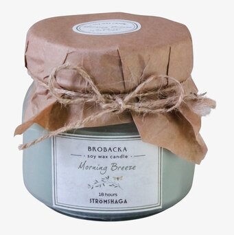 Bild av ett elegant doftljus med rustik förpackning