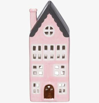 Foto av rosa ljuslykta i form av ett pittoreskt hus