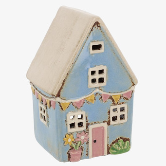 Bild av ljuslykta utformad som ett charmigt litet hus