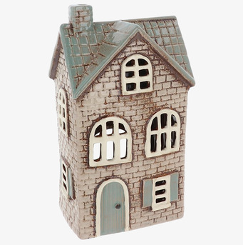 Bild av detaljrik ljuslykta i form av ett charmigt hus