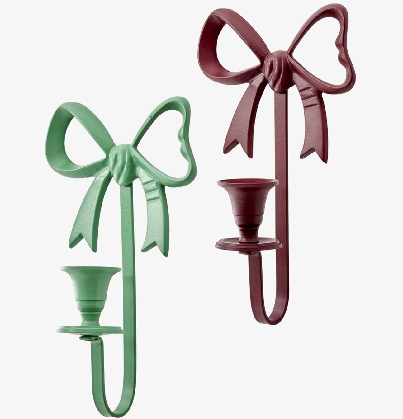 Bild på två rosettformade ljusstakar i grönt och vinrött