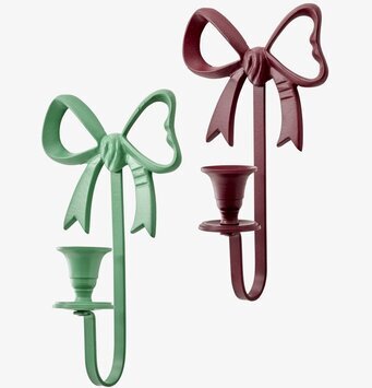 Bild på två rosettformade ljusstakar i grönt och vinrött