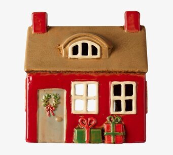 Bild av röd keramiklykta i form av hus med juldekoration