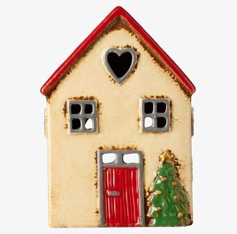 Bild på detaljrik ljuslykta i form av hus med julgran