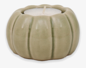 Bild på designad ljuslykta i sagegrön keramik med pumpaform