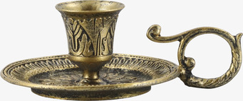 Bild på antik mässingsljusstake med handtag och reliefdekor