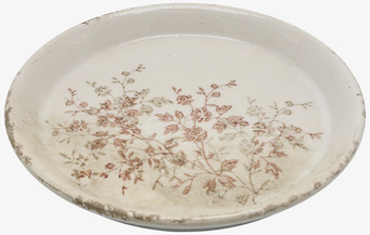 Bild av keramikfat med rustik känsla och blomstermotiv