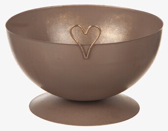 Bild av brun hamrad ljusstake med hjärtdetalj i metall