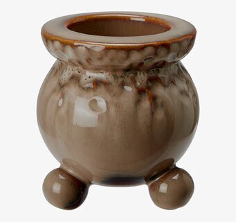 Bild av brunmelerad keramikljusstake med unik glasering