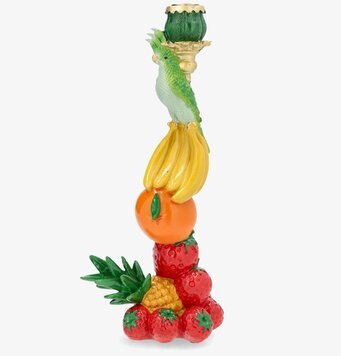 Foto av ljusstake med frukter och grön fågeldekor