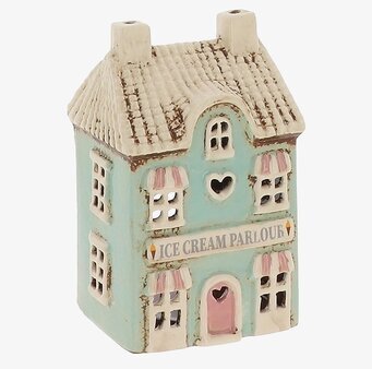 Foto av husformad ljuslykta som glassbutik, blå