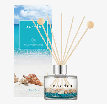 Foto av doftpinnar med snäckor och turkos bottenflis