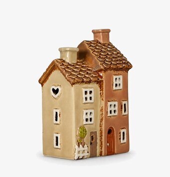 Foto: Keramisk huslykta i rosa/beige mot vit bakgrund