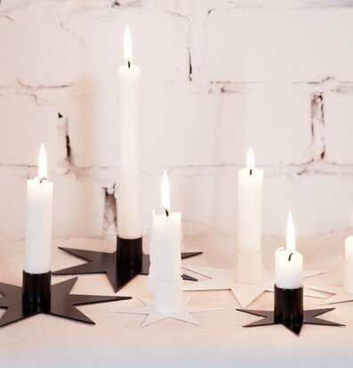Bild av eleganta ljushållare med stjärnformad design