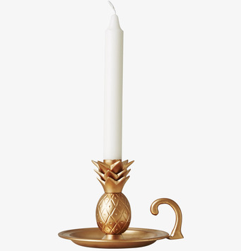Bild av elegant ljusstake i ananasform med guldtoner
