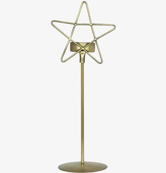 Foto av elegant ljusstake i antik mässing stjärnform