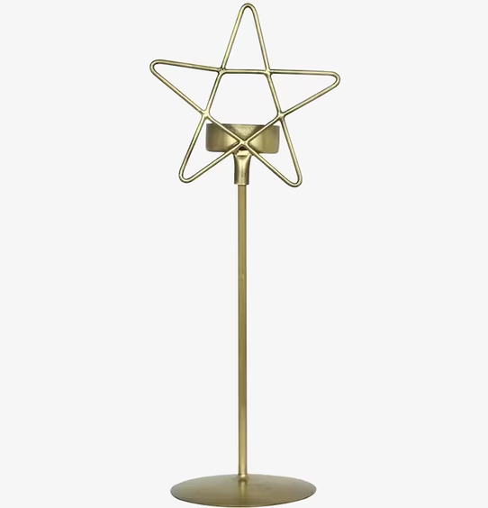 Foto av elegant ljusstake i antik mässing stjärnform