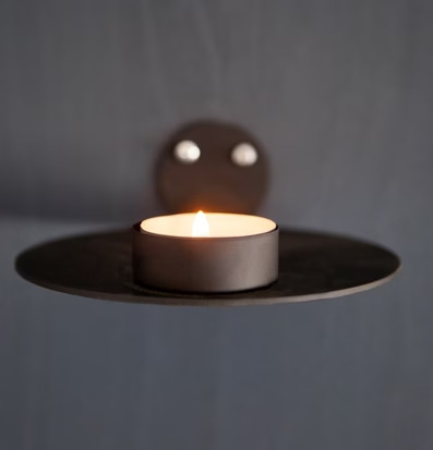 Bild av stilren väggljusstake i grått för heminredning