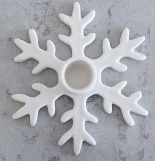 Bild av stilren ljusstake formad som en snöflinga