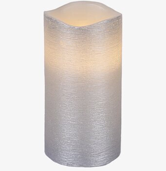 Bild av dekorativt vaxljus i silverton med struktur